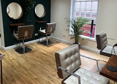Cozy, modern salon chairs and mirrors at Natural Hair Studio, Horsham, England, GB.