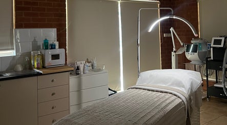 Inviting treatment room at Skiin Studio by Paige, Sydney, New South Wales, AU, with modern equipment and cozy bed.