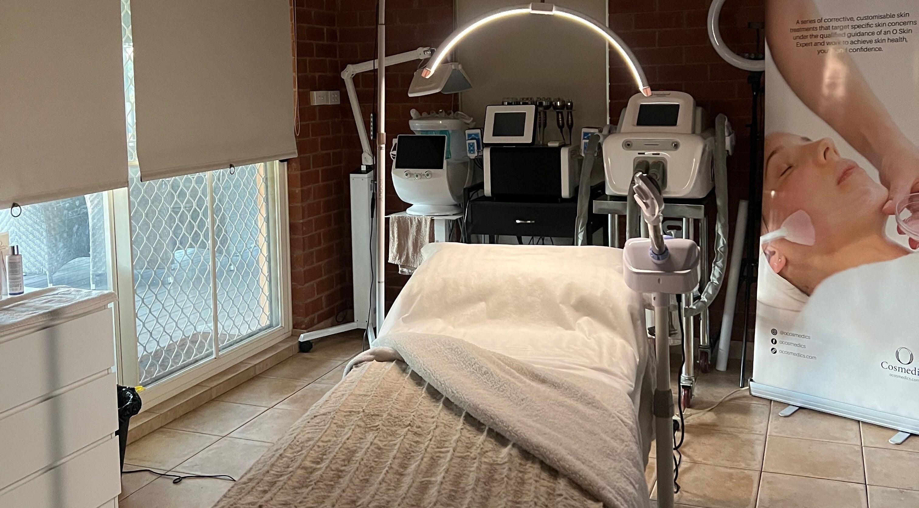 Spa treatment room at Skiin Studio by Paige, Sydney, New South Wales, AU, featuring modern beauty equipment.
