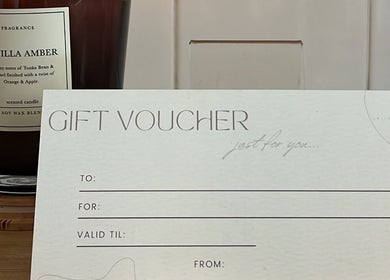 Gift voucher and candle at Skiin Studio by Paige in Sydney, New South Wales, AU, offering a luxurious experience.