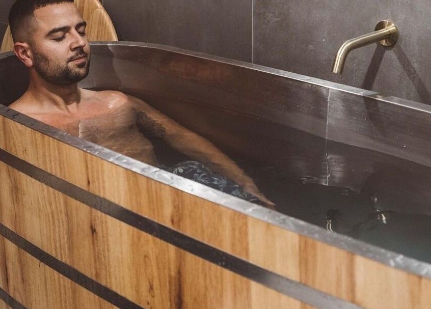 Relaxing bath experience at WYLD Newmarket, Auckland, Auckland, NZ in a luxurious wooden tub.