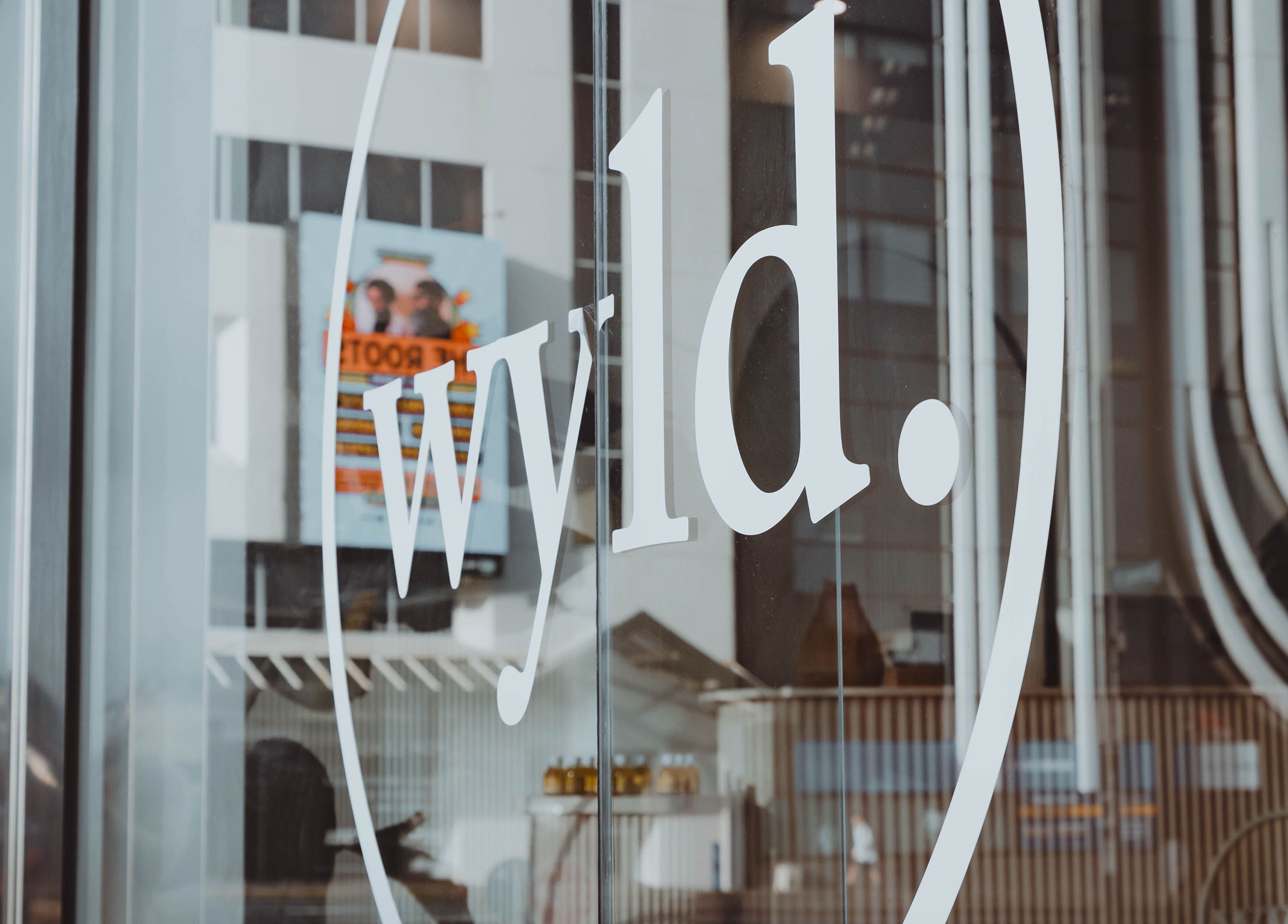 Front window of WYLD Newmarket in Auckland, Auckland, NZ showcasing modern sleek design.