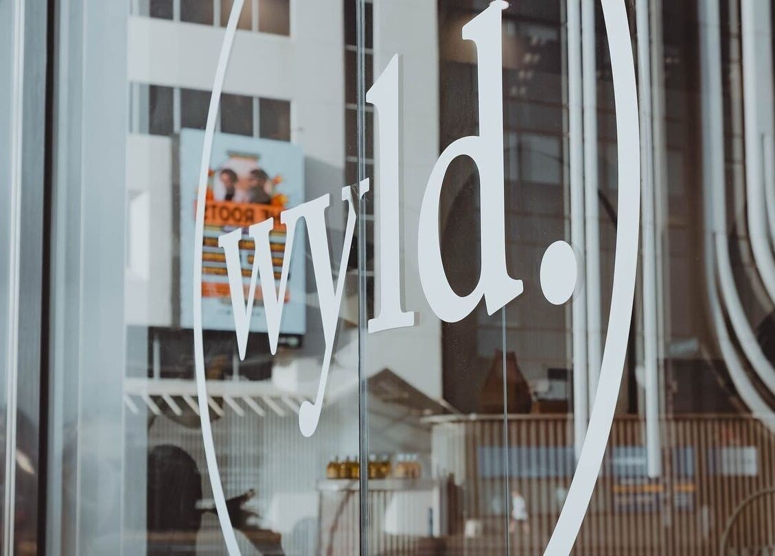 Glass door with WYLD Howick logo at Auckland, Auckland, NZ.