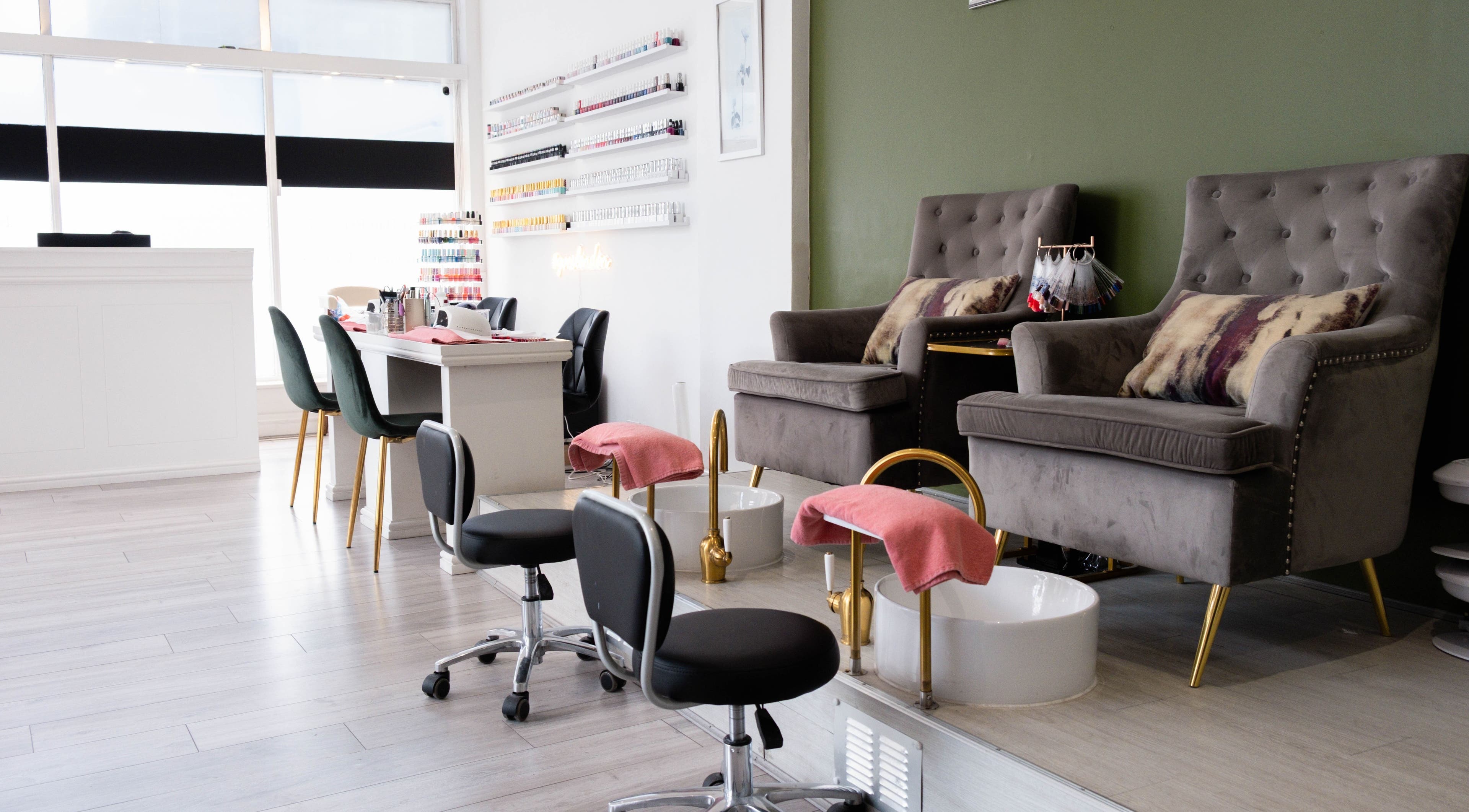 Elegant pedicure setup at Yves London in London, England, GB featuring plush chairs and modern décor.