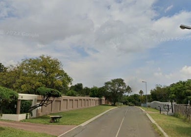 Ozone venue entrance in Roodepoort, Gauteng, ZA with lush greenery and modern architecture.
