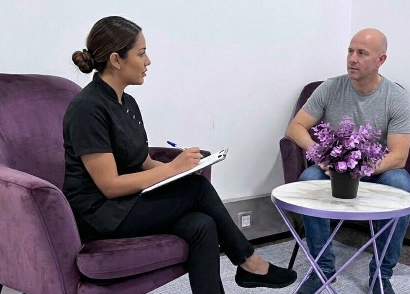 Client consultation at Lashes London Mobile Service, London, England, GB. Relaxing space with purple chairs.