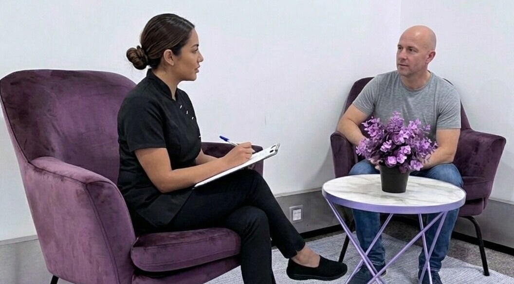 Client consultation at Lashes London Mobile Service, London, England, GB. Relaxing space with purple chairs.