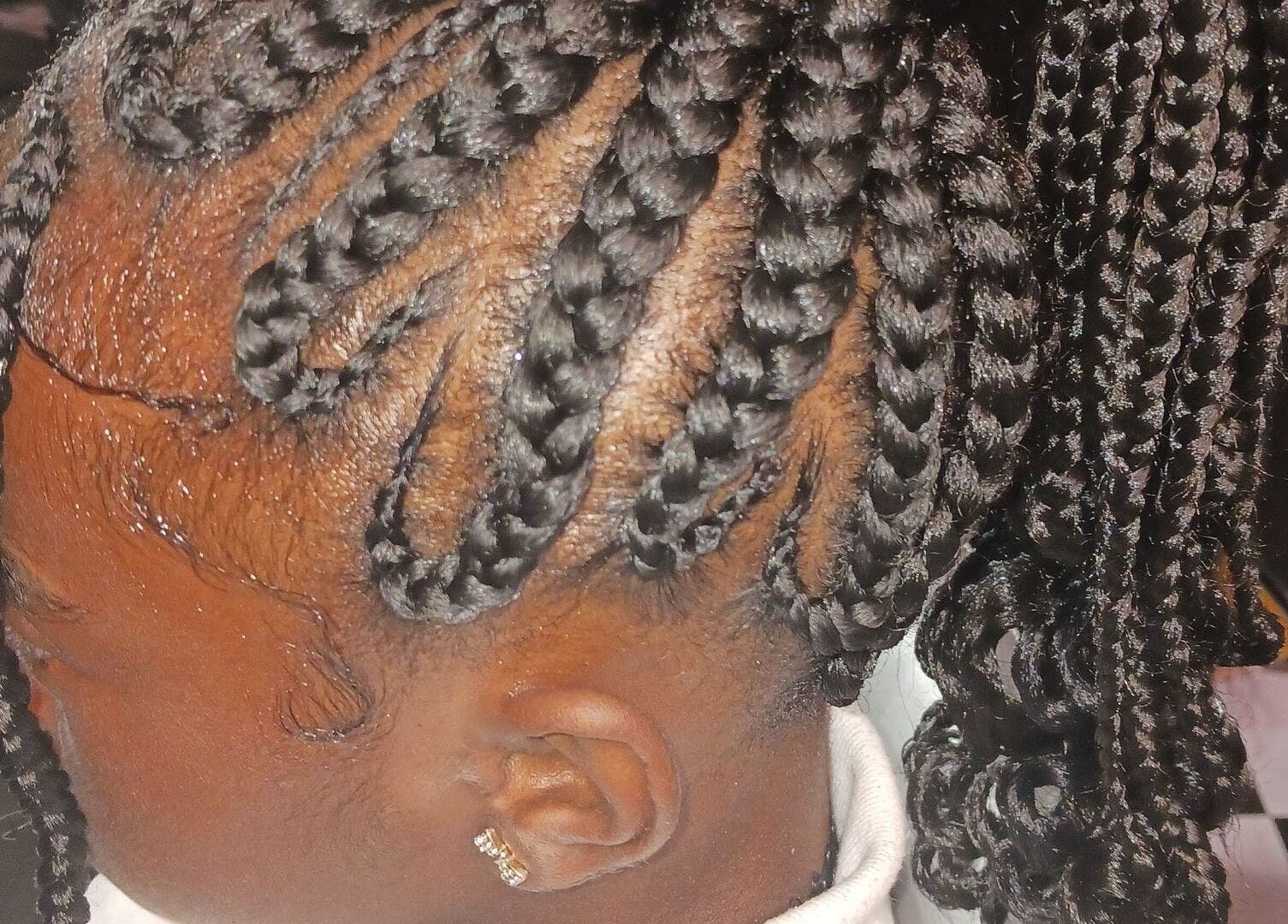 Intricate braided hairstyle at Styles By Nicki in Macon, Georgia, US, showcasing detailed craftsmanship.