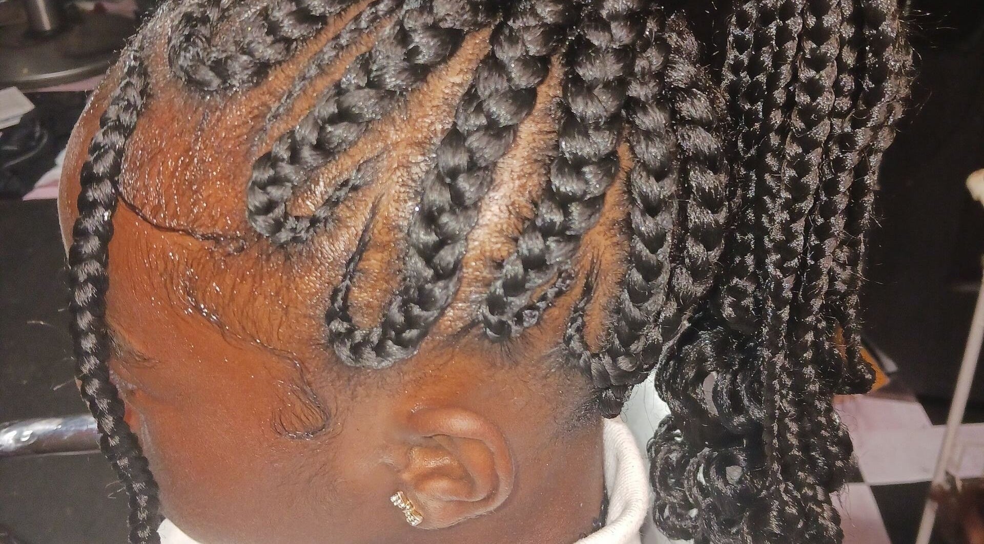 Intricate braided hairstyle at Styles By Nicki in Macon, Georgia, US, showcasing detailed craftsmanship.
