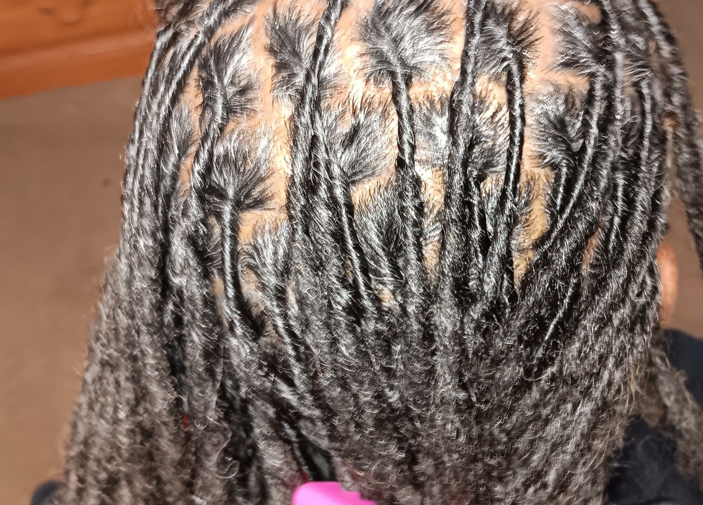 Intricate braided hairstyle at Styles By Nicki, Macon, Georgia, US, showcasing detailed craftsmanship.