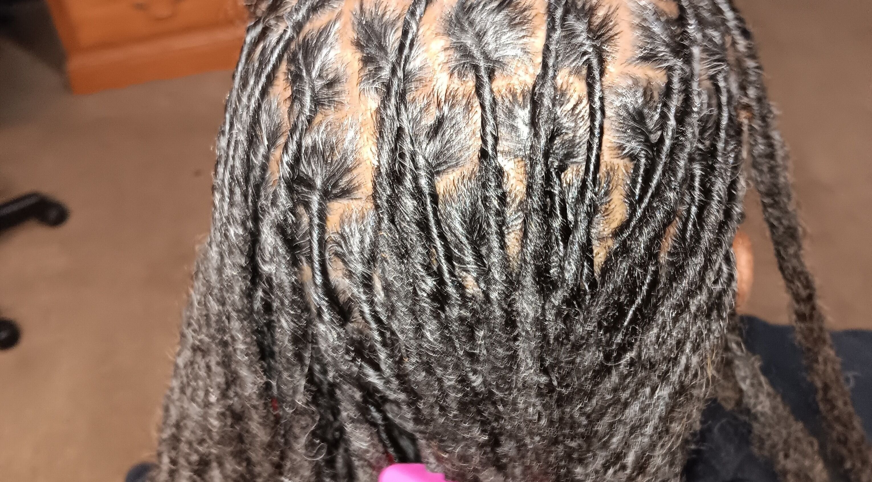 Intricate braided hairstyle at Styles By Nicki, Macon, Georgia, US, showcasing detailed craftsmanship.