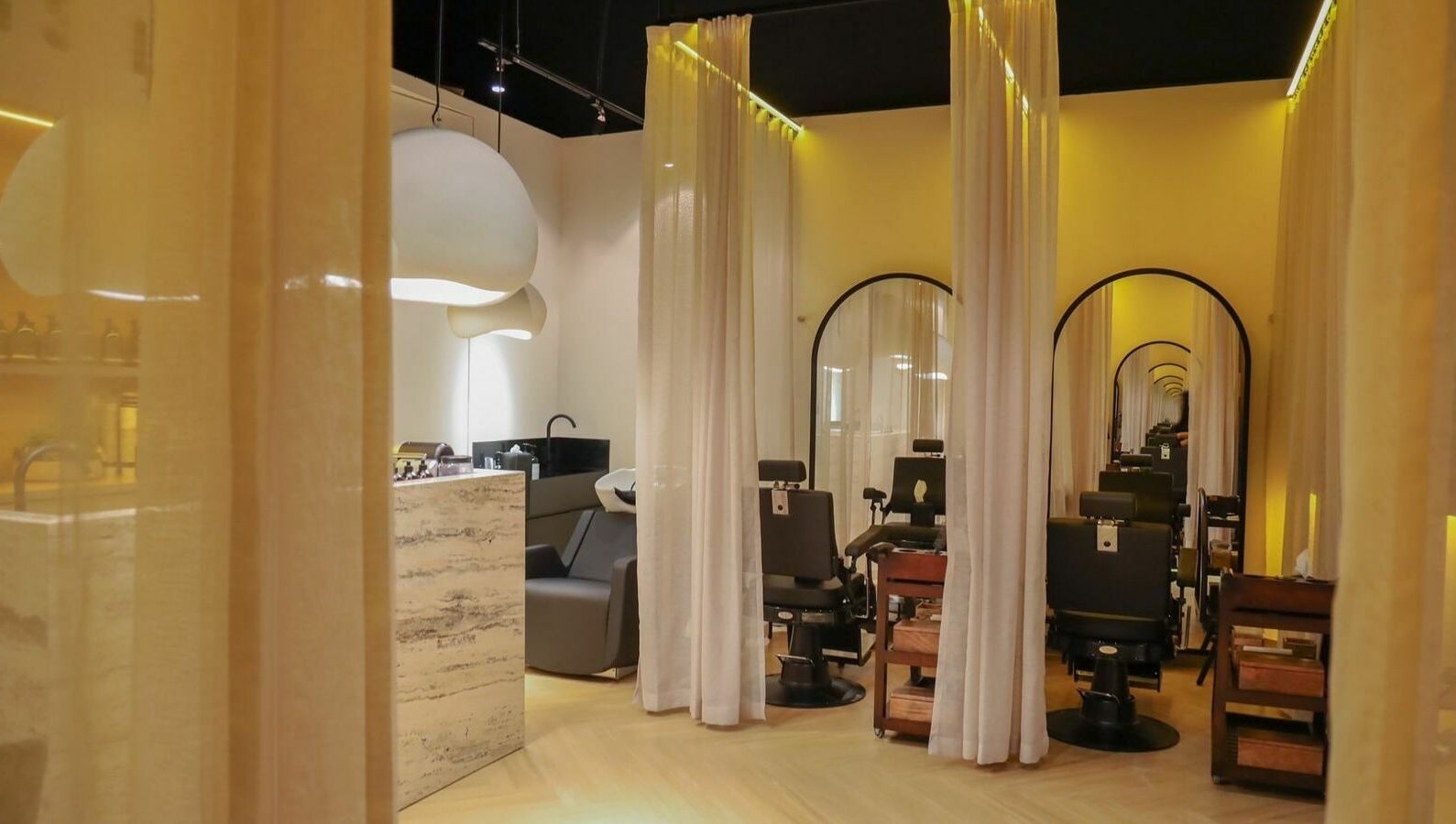 Chic interior of Roots Lab Beauty Salon in Dubai, AE with elegant decor and luxurious seating.