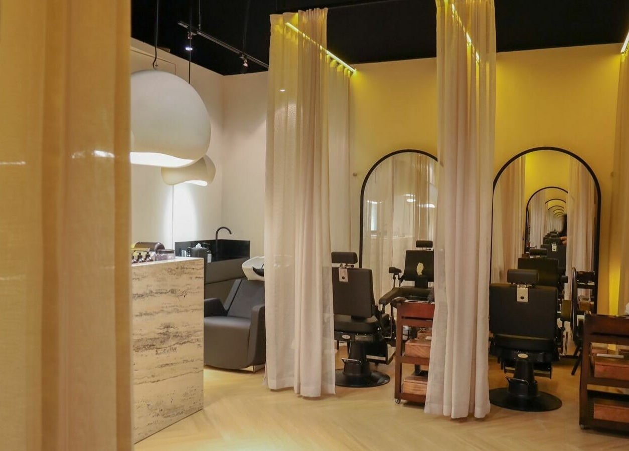 Chic interior of Roots Lab Beauty Salon in Dubai, AE with elegant decor and luxurious seating.