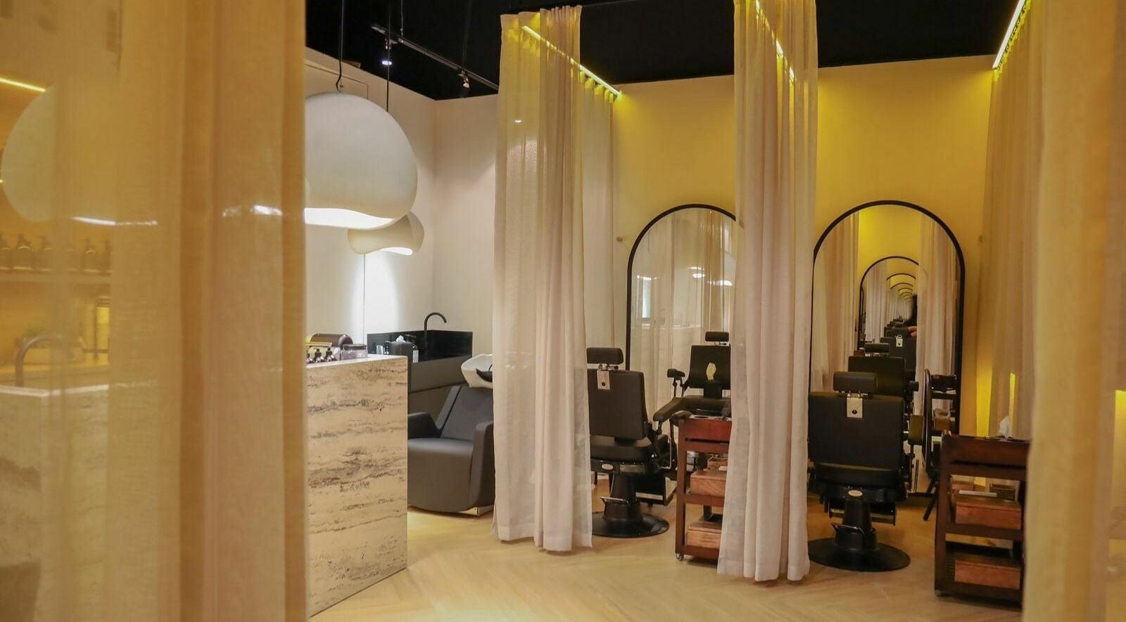 Chic interior of Roots Lab Beauty Salon in Dubai, AE with elegant decor and luxurious seating.
