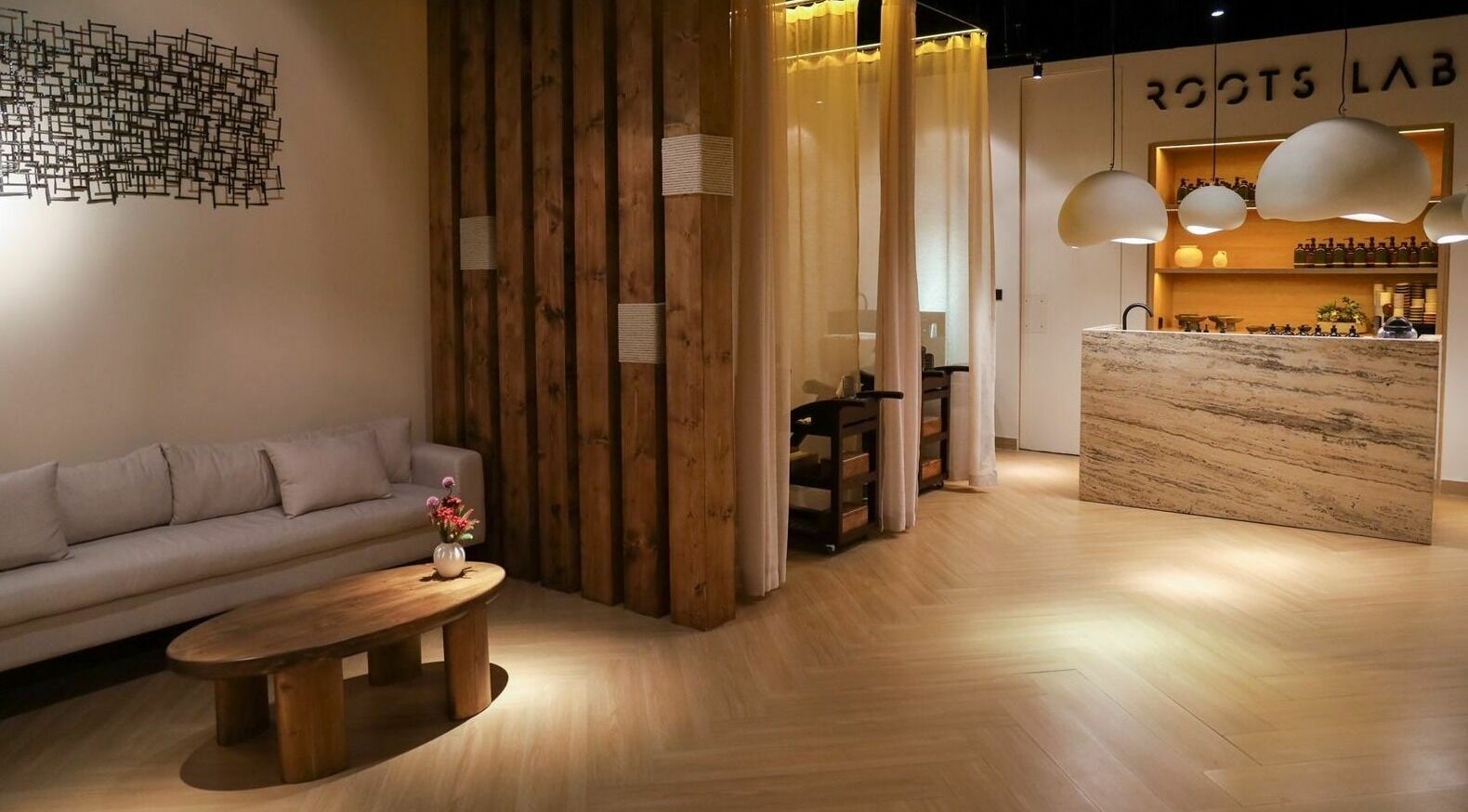 Elegant interior of Roots Lab Beauty Salon in Dubai, AE, featuring cozy seating and ambient lighting.