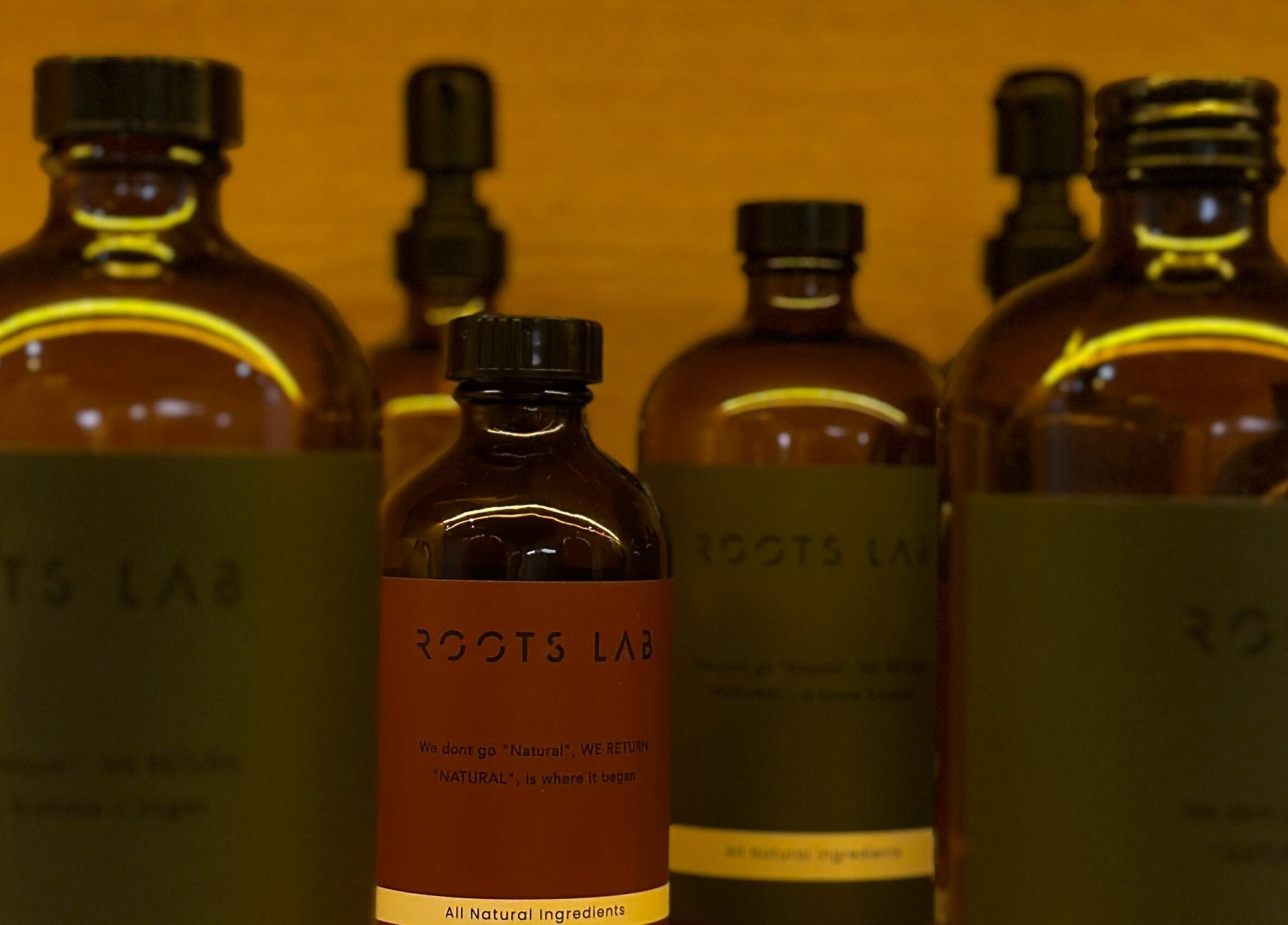 Natural product bottles at Roots Lab Beauty Salon, Dubai, AE, offering organic beauty solutions.