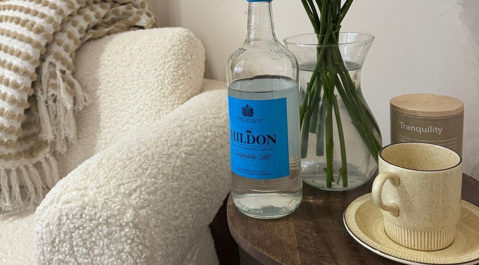 Cozy Hygge Well corner in Otley, England featuring water, vase, and mug for relaxation.