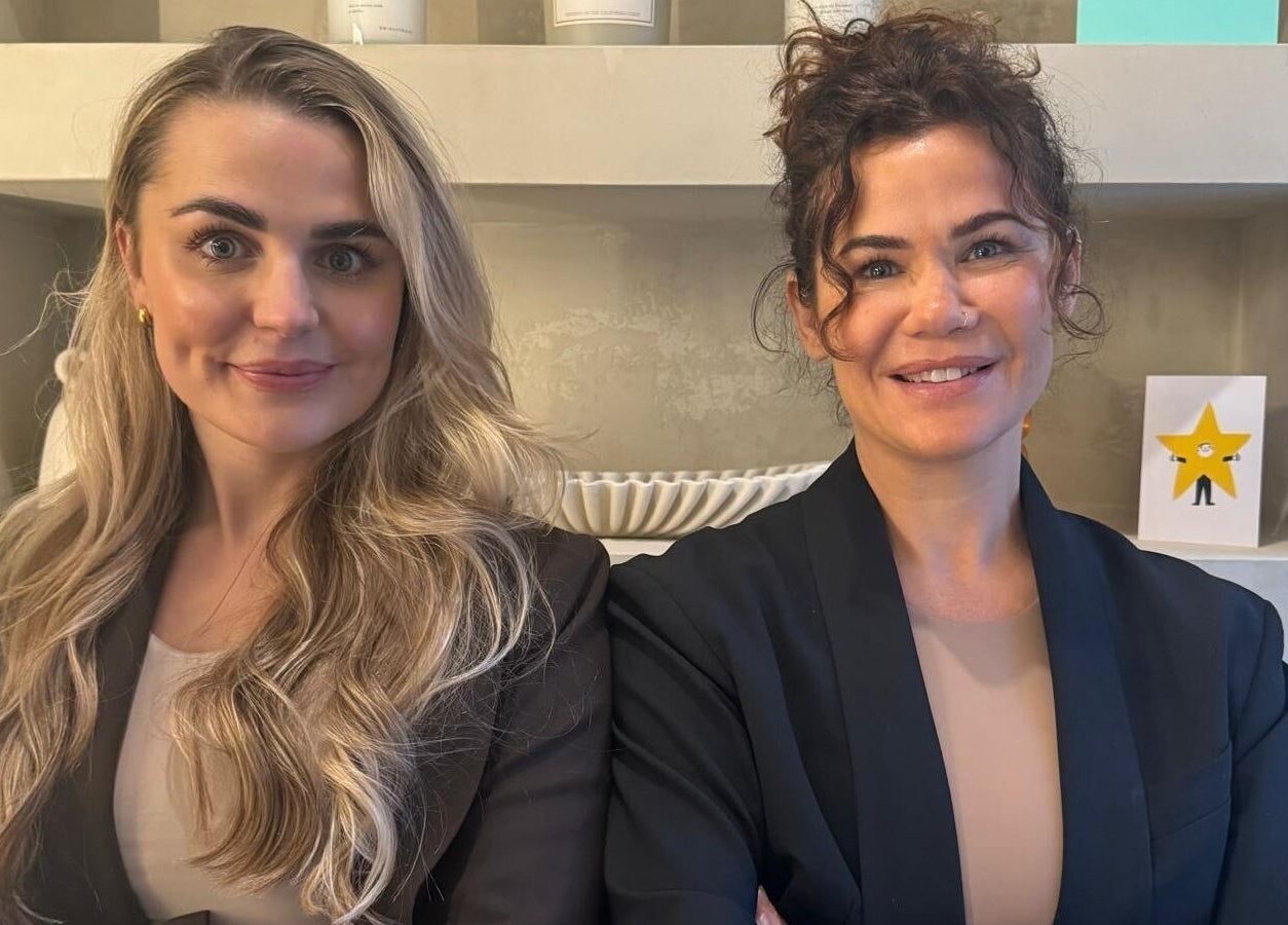 Two smiling women at Hygge Well, Otley, England, GB, embody wellness and hospitality.