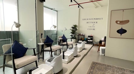 Elegant pedicure area at Dalm Beauty Salon, Jeddah, Makkah Province, SA, featuring cozy chairs and stylish decor.
