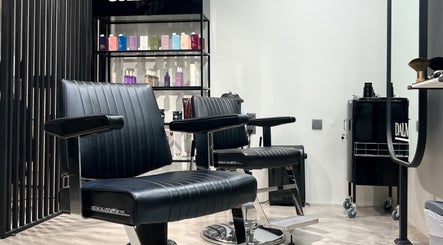 Barber chairs and product shelves at Dalm Beauty Salon, Jeddah, Makkah Province, SA.