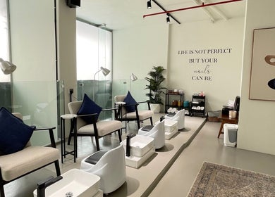 Chic nail salon at Dalm Beauty Salon, Jeddah, Makkah Province, SA with comfortable seating and elegant decor.
