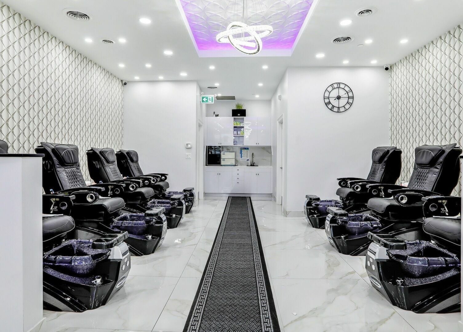 Luxurious pedicure chairs at Maxxie Nails, Vaughan, Ontario, CA. Sleek interior with modern decor.