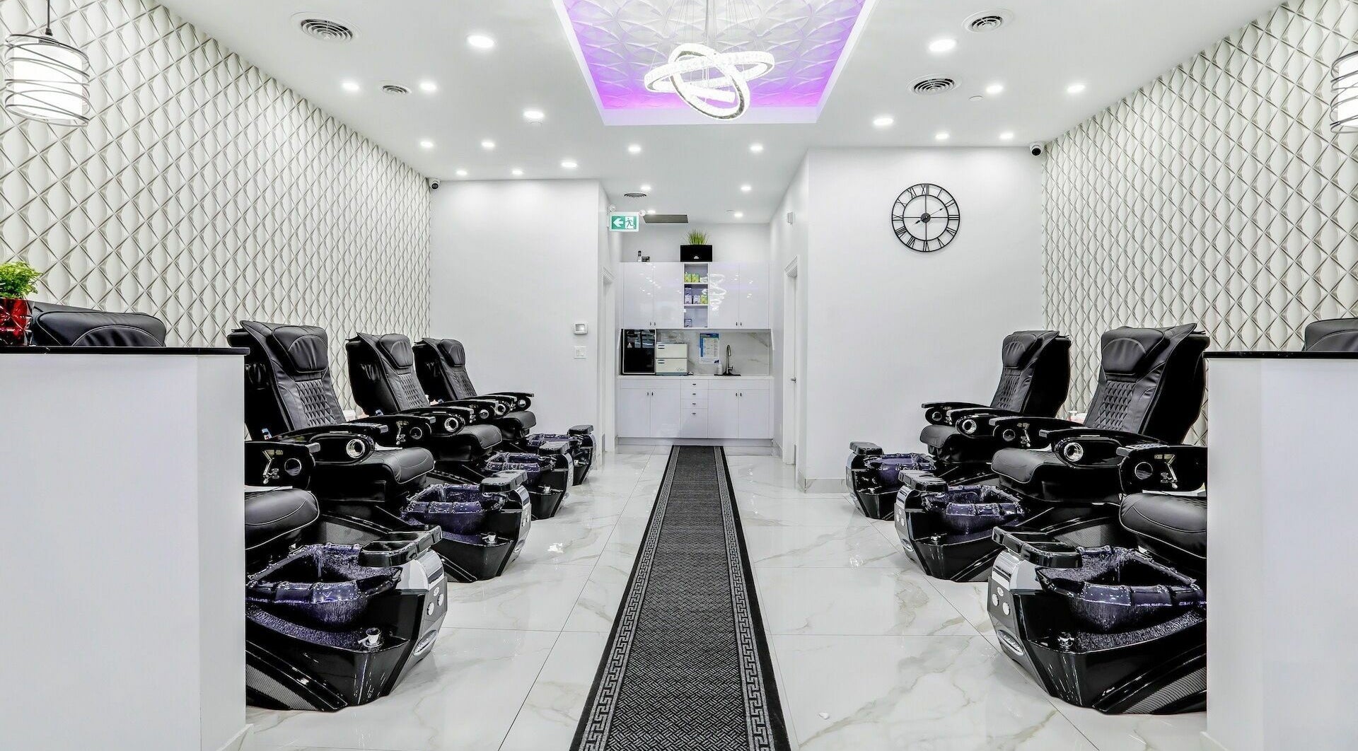 Luxurious pedicure chairs at Maxxie Nails, Vaughan, Ontario, CA. Sleek interior with modern decor.