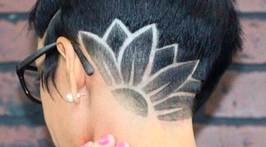 Unique geometric hairstyle at Vitalia Spa, Willemstad, Curaçao, CW, showcasing barbering art.