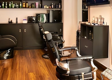 Modern salon interior at Espada, Dhahran, Eastern Province, SA with sleek chairs and product displays.
