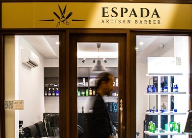 Espada Artisan Barber storefront in Dhahran, Eastern Province, SA, showcasing sleek interior and product displays.