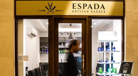 Espada Artisan Barber storefront in Dhahran, Eastern Province, SA, showcasing sleek interior and product displays.