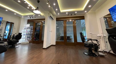 Stylish interior of Espada beauty salon in Dhahran, Eastern Province, SA, featuring sleek design and hair styling chairs.