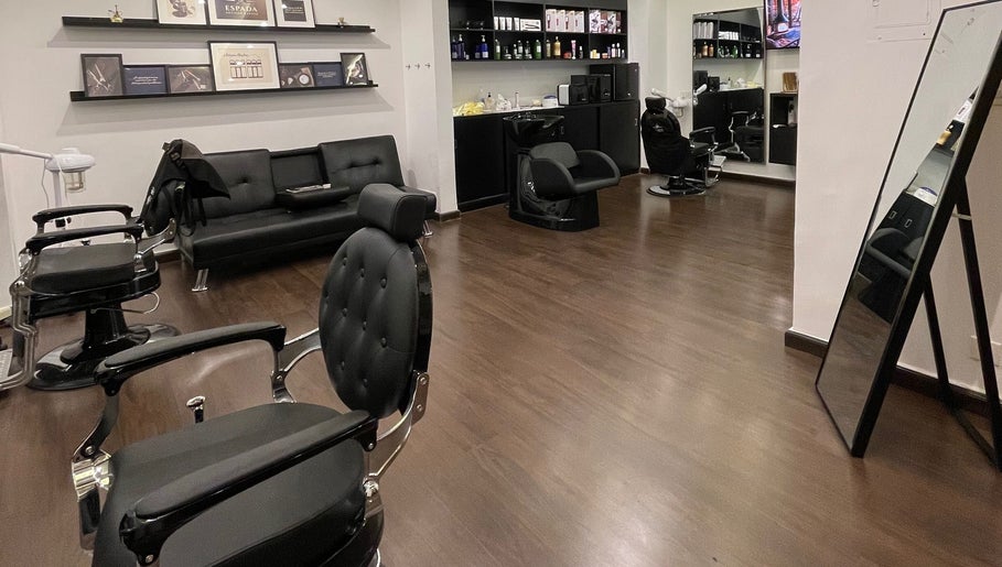 Interior of Espada salon in Dhahran, Eastern Province, SA showcasing modern black salon chairs and elegant decor.