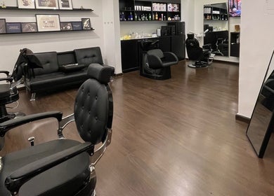 Interior of Espada salon in Dhahran, Eastern Province, SA showcasing modern black salon chairs and elegant decor.