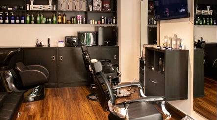 Espada salon interior in Dhahran, Eastern Province, SA, featuring modern black salon chairs and sleek decor.