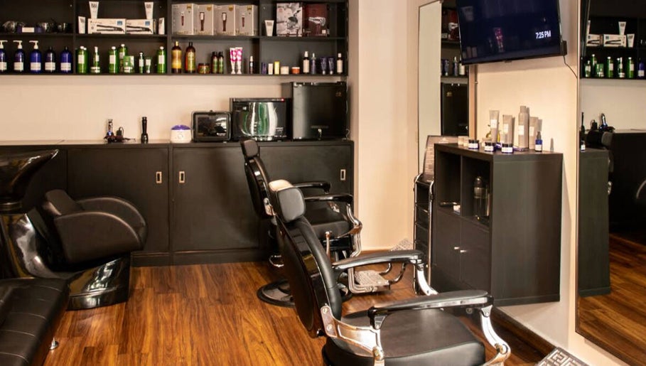 Espada salon in Dhahran, Eastern Province, SA features sleek black chairs and modern styling tools.