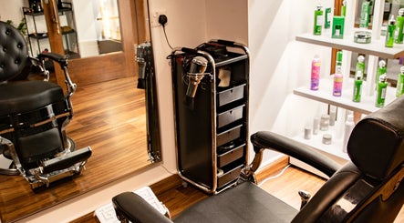 Elegant salon interior at Espada, Dhahran, Eastern Province, SA, showcasing a modern styling chair and products.