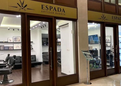 View of Espada barber shop interior in Dhahran, Eastern Province, SA showcasing stylish design and seating.