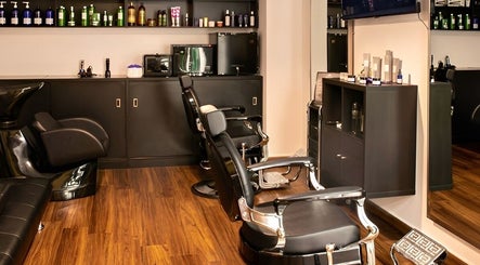 Elegant interior of Espada salon in Dhahran, Eastern Province, SA with stylish black chairs and products.