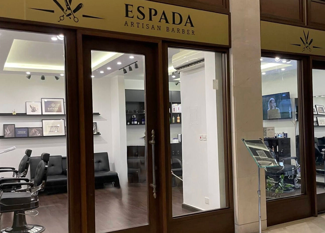 Interior view of Espada salon in Dhahran, Eastern Province, SA showcasing stylish barber chairs and decor.