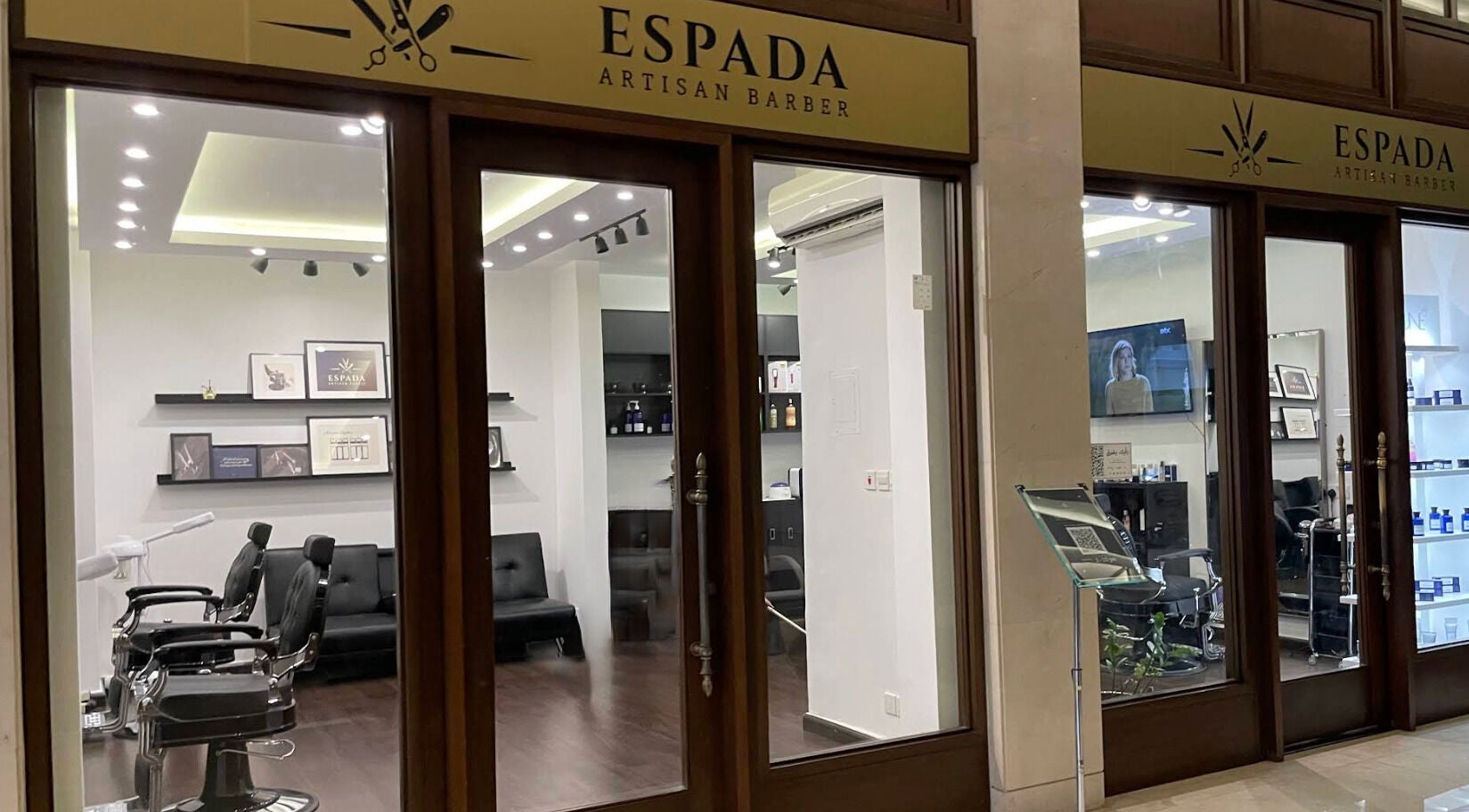 Interior view of Espada salon in Dhahran, Eastern Province, SA showcasing stylish barber chairs and decor.