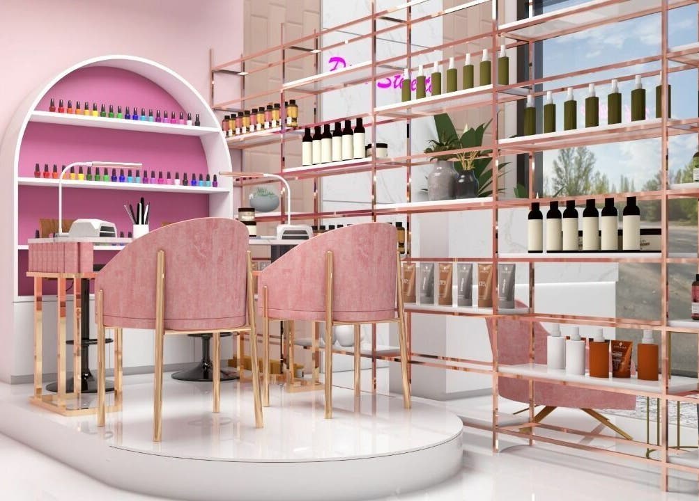 Elegant beauty setup at Pink Stiletto by Shweta, Dubai, AE. Cozy pink chairs and colorful nail polishes create a stylish vibe.