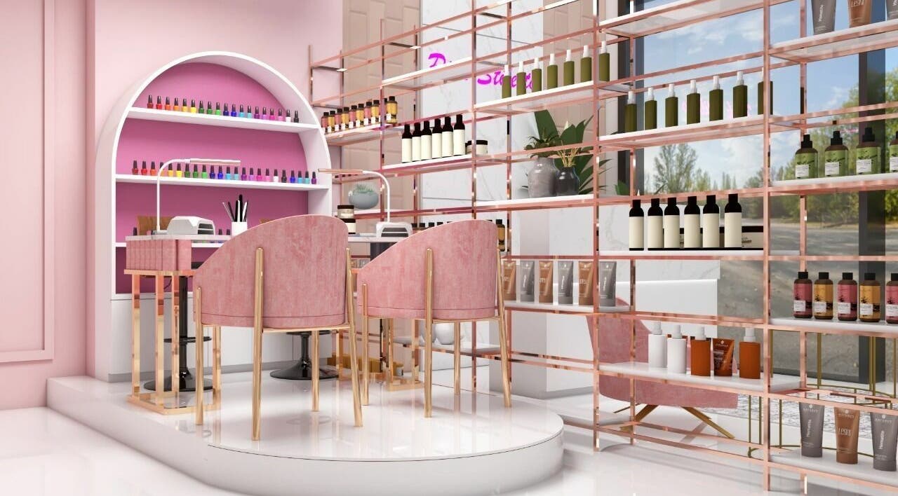 Elegant beauty setup at Pink Stiletto by Shweta, Dubai, AE. Cozy pink chairs and colorful nail polishes create a stylish vibe.