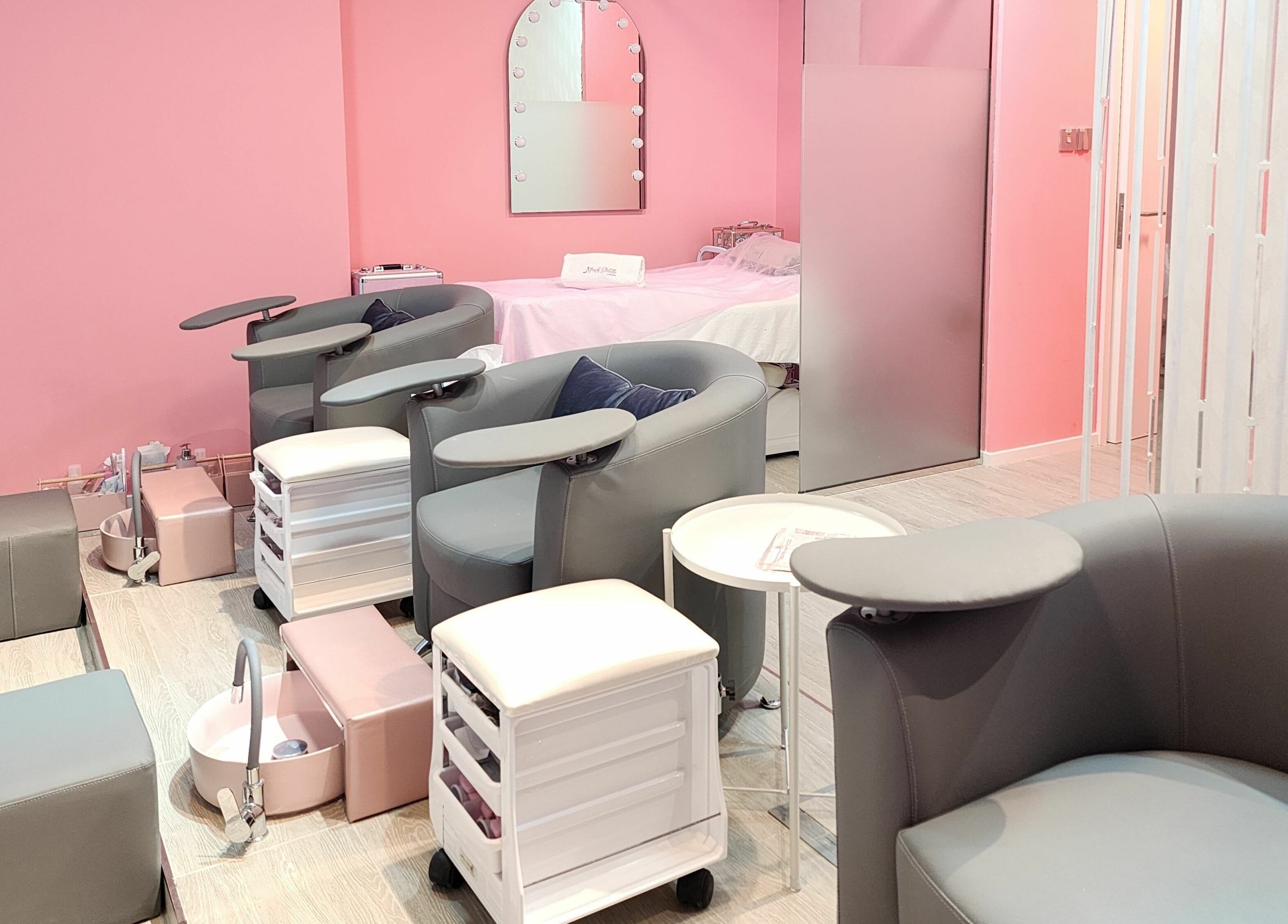 Elegant nail spa lounge at Pink Stiletto by Shweta, Dubai, Dubai, AE with modern seating and pastel decor.