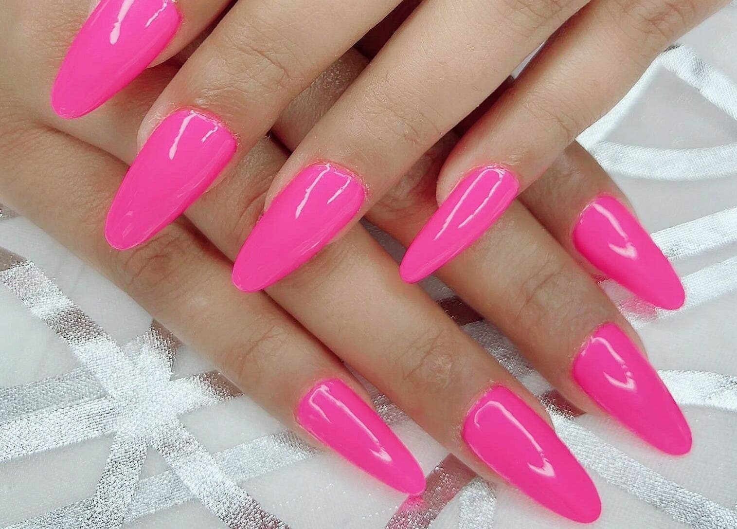 Bright pink stiletto nails from Pink Stiletto by Shweta in Dubai, Dubai, AE.