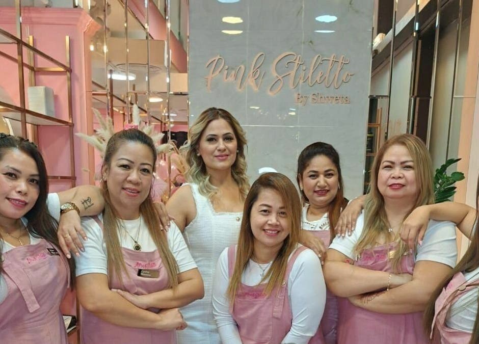 Smiling team at Pink Stiletto by Shweta, Dubai, Dubai, AE salon, showcasing hospitality and style.