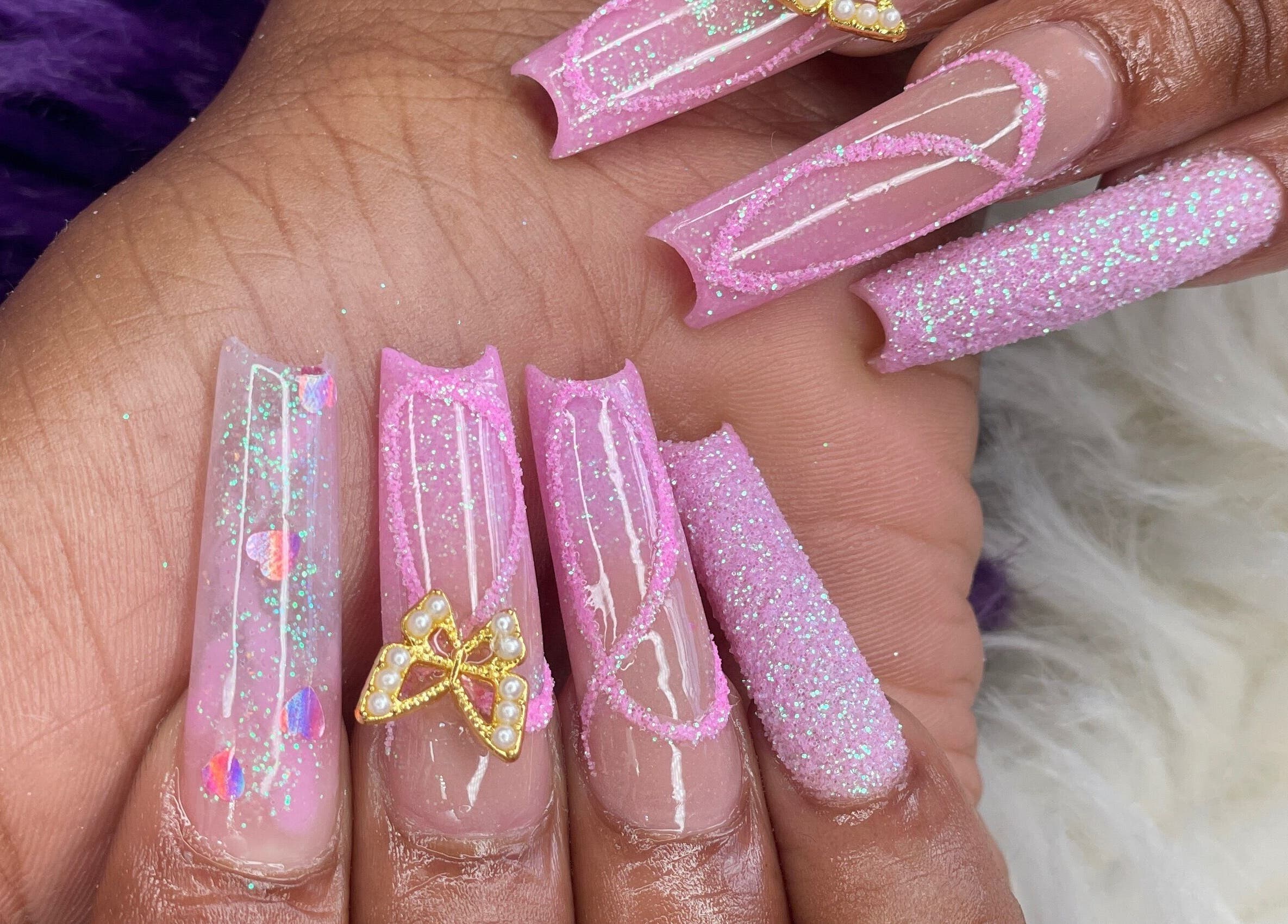 Pink glitter nails with butterfly art at Beautify Me by LC, Montego Bay, St. James Parish, JM.