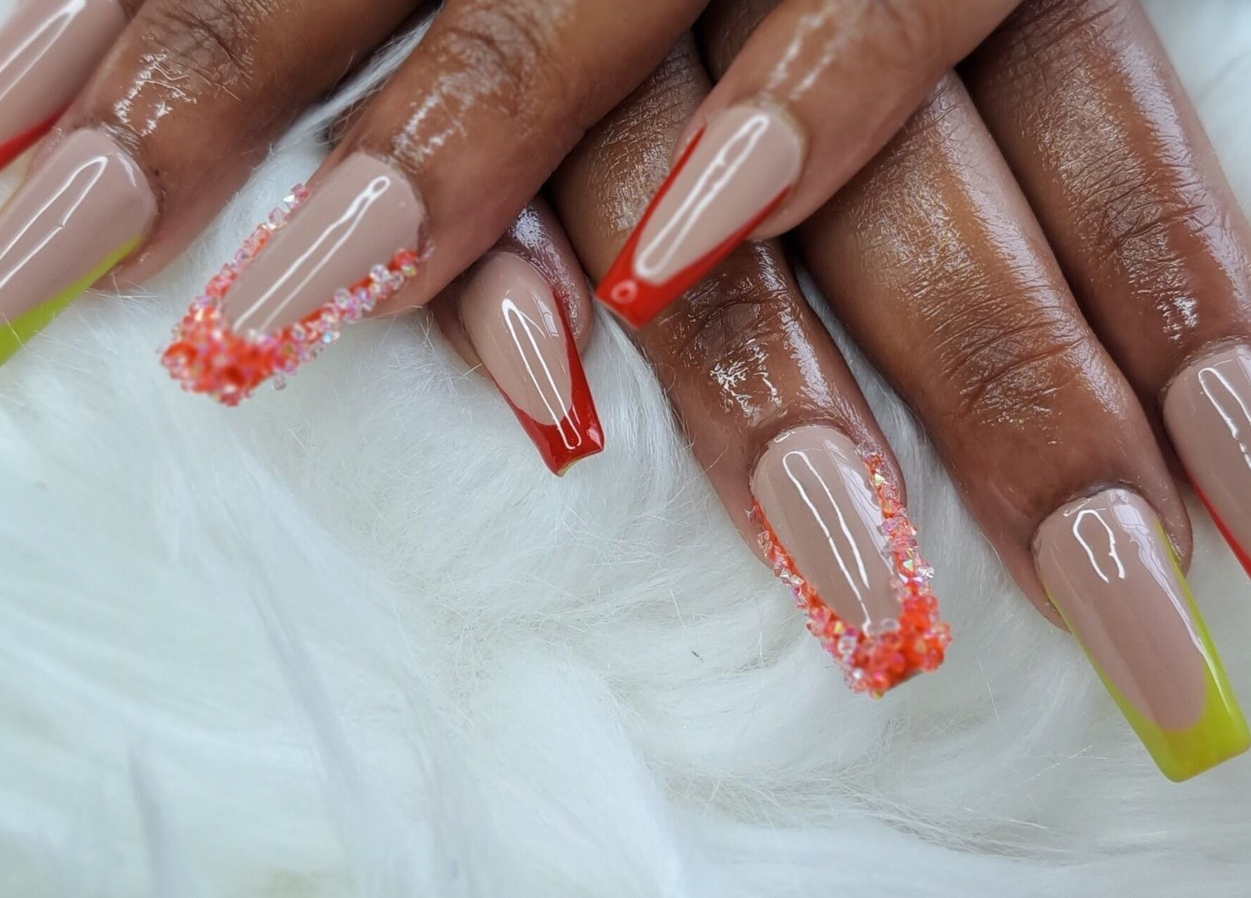 Bold nail art at Beautify Me by LC, Montego Bay, St. James Parish, JM showcasing colorful tips with intricate designs.