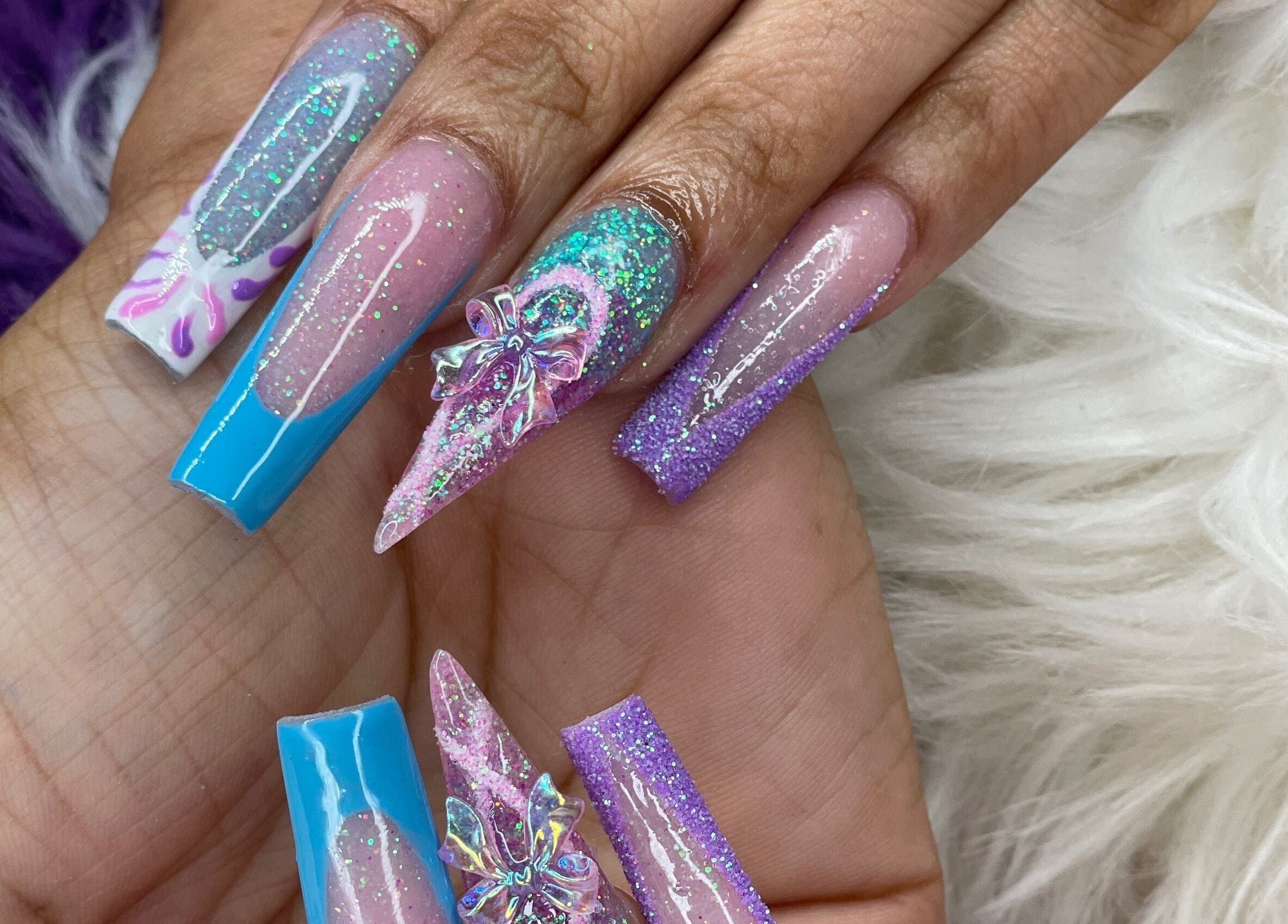 Elegant nail art at Beautify Me by LC, Montego Bay, St. James Parish, JM featuring intricate designs and vibrant colors.
