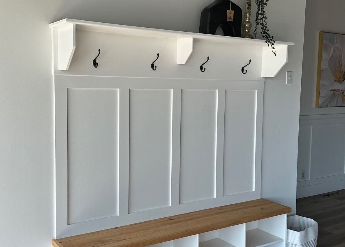 Elegant wooden bench with hooks at The Loft Spa, Barrington Passage, Nova Scotia, CA.